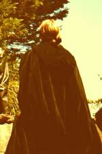 rebecca is wearing an outsize cloak.